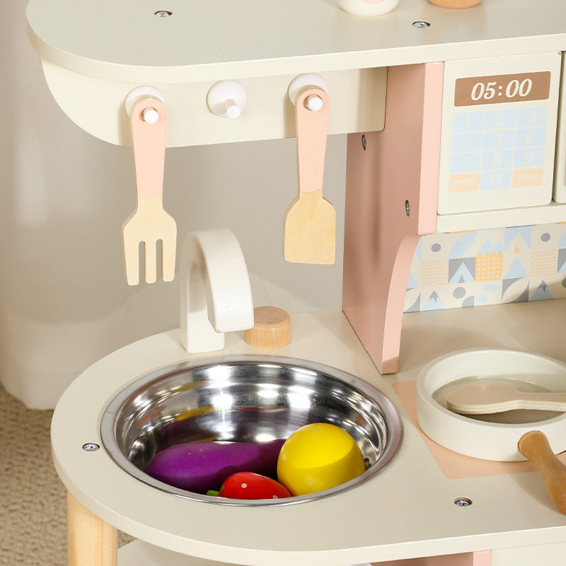 Pink wooden pretend kitchen detail 4: oven, sink, accessories and storage