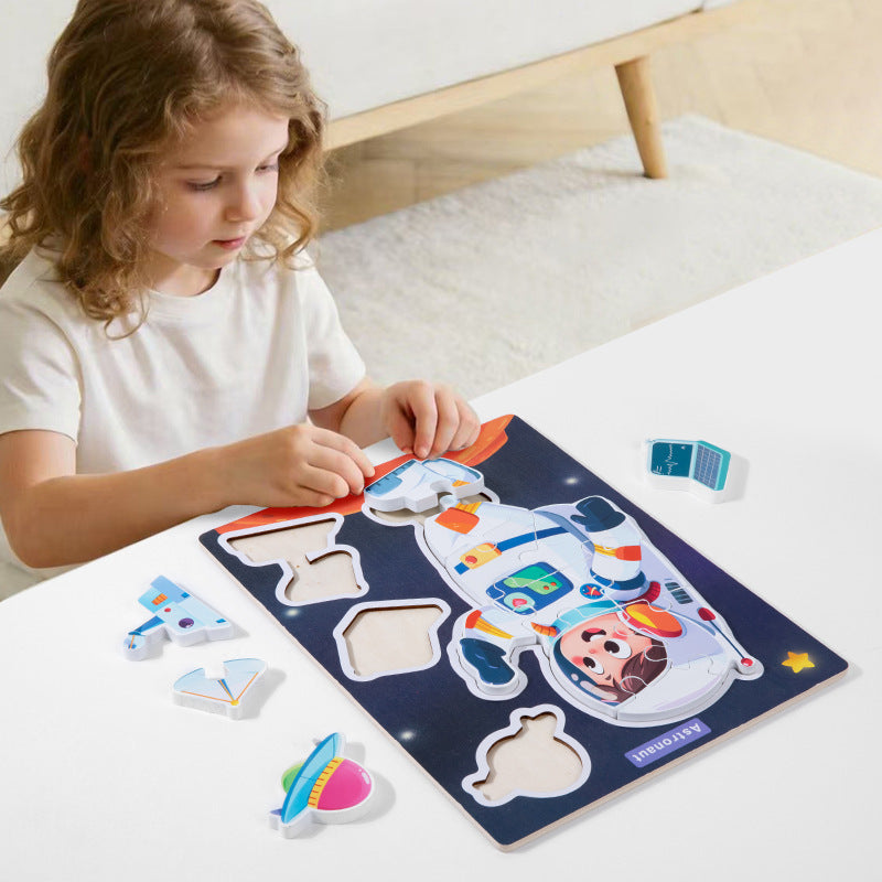 Child playing with the astronaut matching puzzle