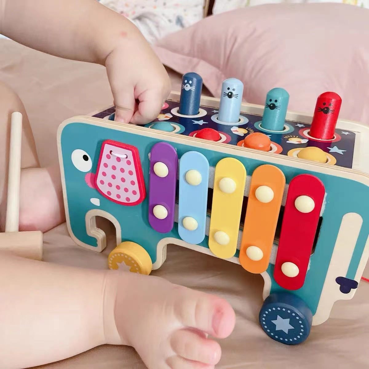 Caregiver guiding child's tapping game