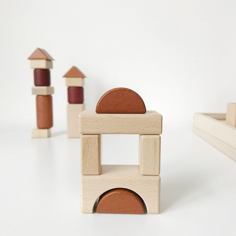 Stacked wooden building blocks in neutral coffee and natural colors