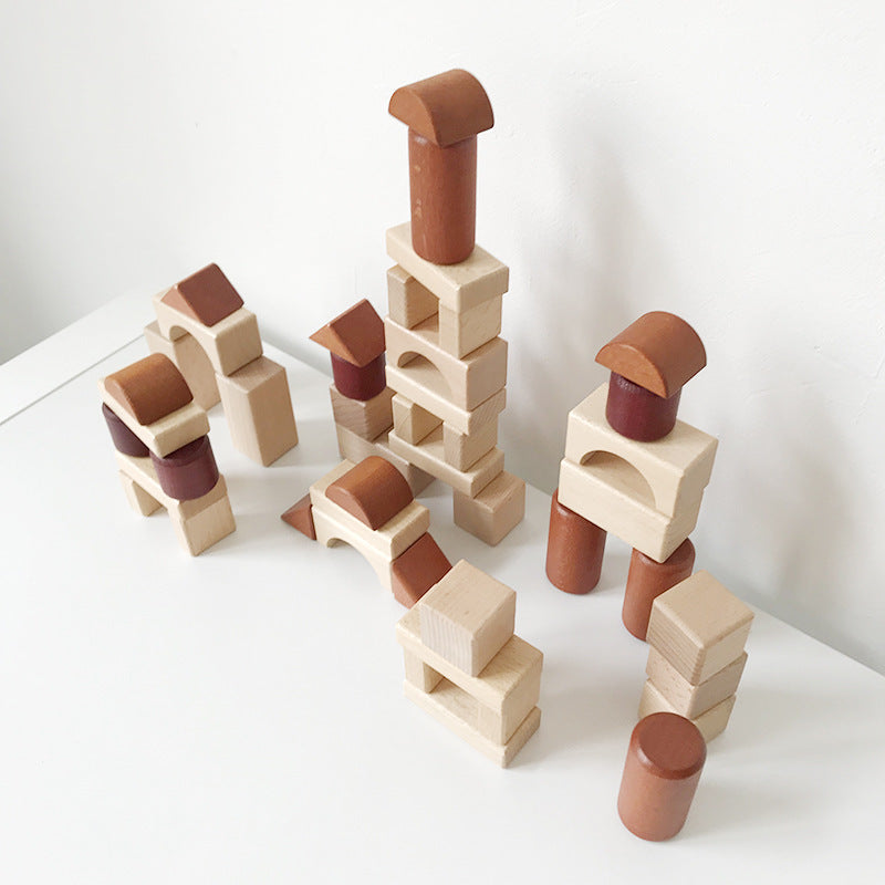 Montessori wooden shapes making imaginative city, towers and buildings