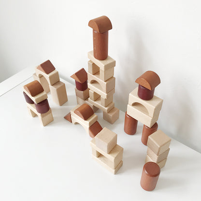Montessori wooden shapes making imaginative city, towers and buildings