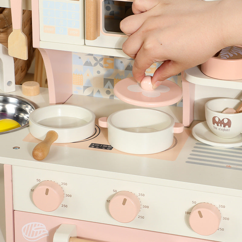 Pink wooden pretend kitchen detail 3: oven, sink, accessories and storage