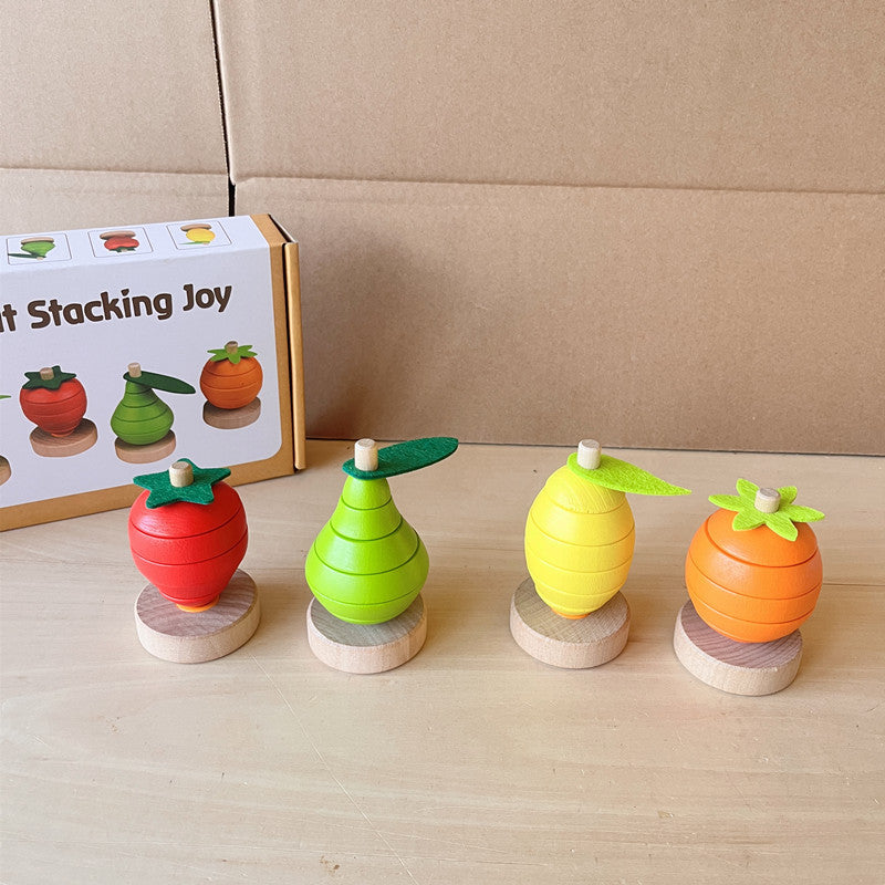 Four wooden fruit stacking toys in orange strawberry lemon and pear with felt leaves